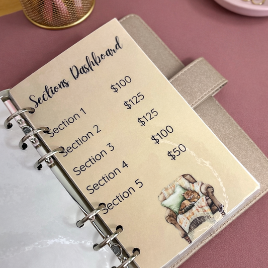 Notebook with sections on a desk with stationery items
