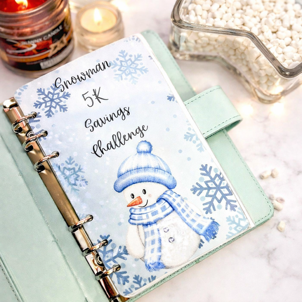 Planner with snowman design and 'Snowman 5K Savings Challenge' text on a light background.