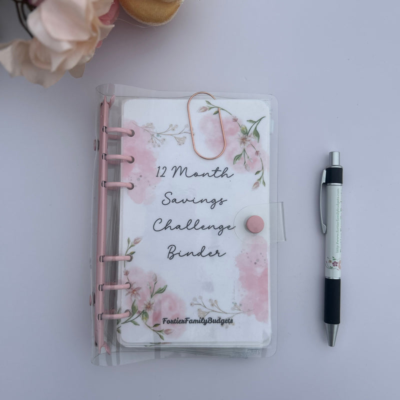 12 Month Savings Challenge Binder with floral design on a light gray background