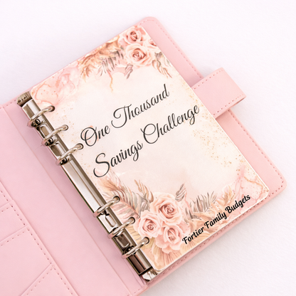 Pink planner with floral design and text on a white background