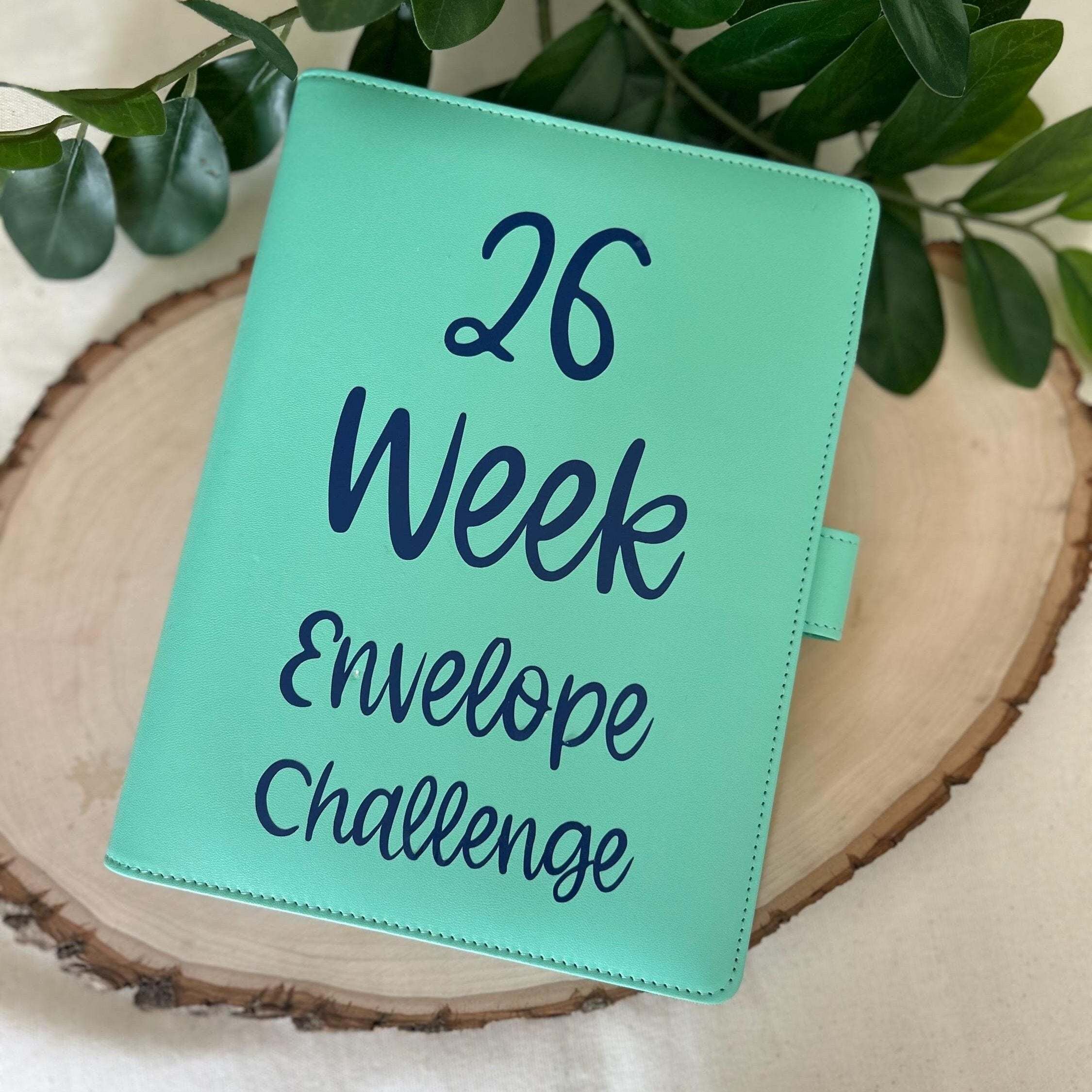 Minimalist 26 Week Savings Challenge printable with numbered envelopes and savings goals, designed for budgeting and money-saving enthusiasts to track progress and achieve financial goals efficiently.