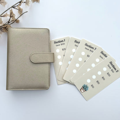 Beige planner with five discount cards on a white background