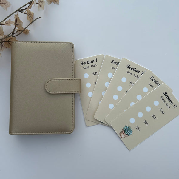 Beige planner with polka dot cards on a white background