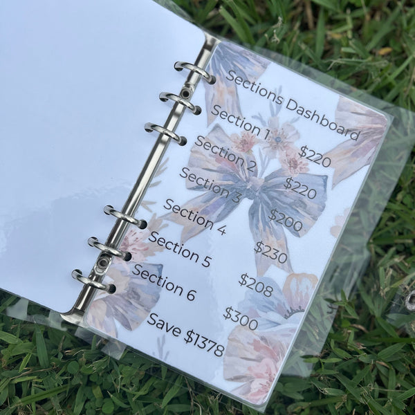 Planner with financial dashboard on grass