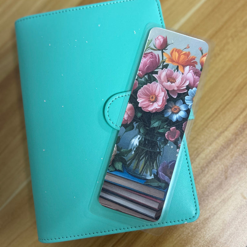 A set of floral botanical bookmarks featuring delicate flower illustrations and book-themed designs, displayed on a neutral background. Perfect for readers, journalers, and stationery lovers.