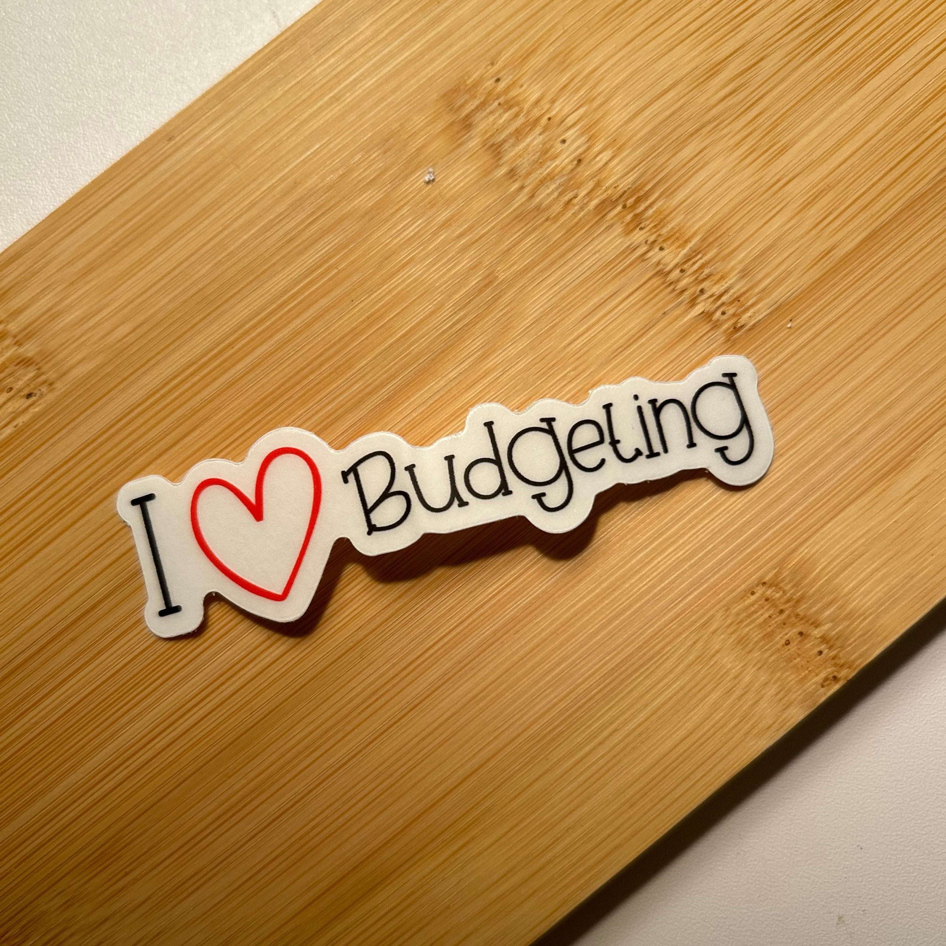 This Custom sticker that is colorful 'I Love Budgeting' sticker featuring bold, playful lettering with a heart icon, perfect for planners, laptops, or journals to show off a love for financial planning and money management.