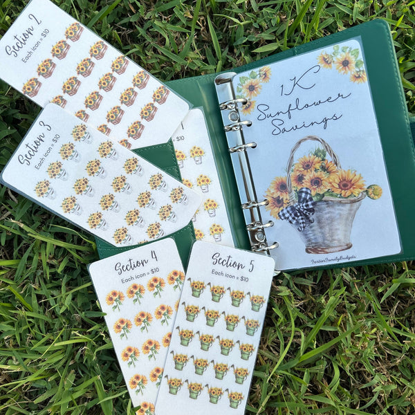 Planner with sunflower-themed stickers on a grass background