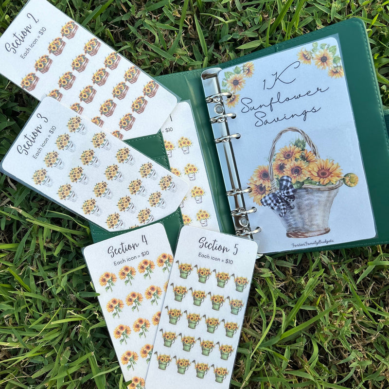Planner with sunflower-themed stickers on a grass background