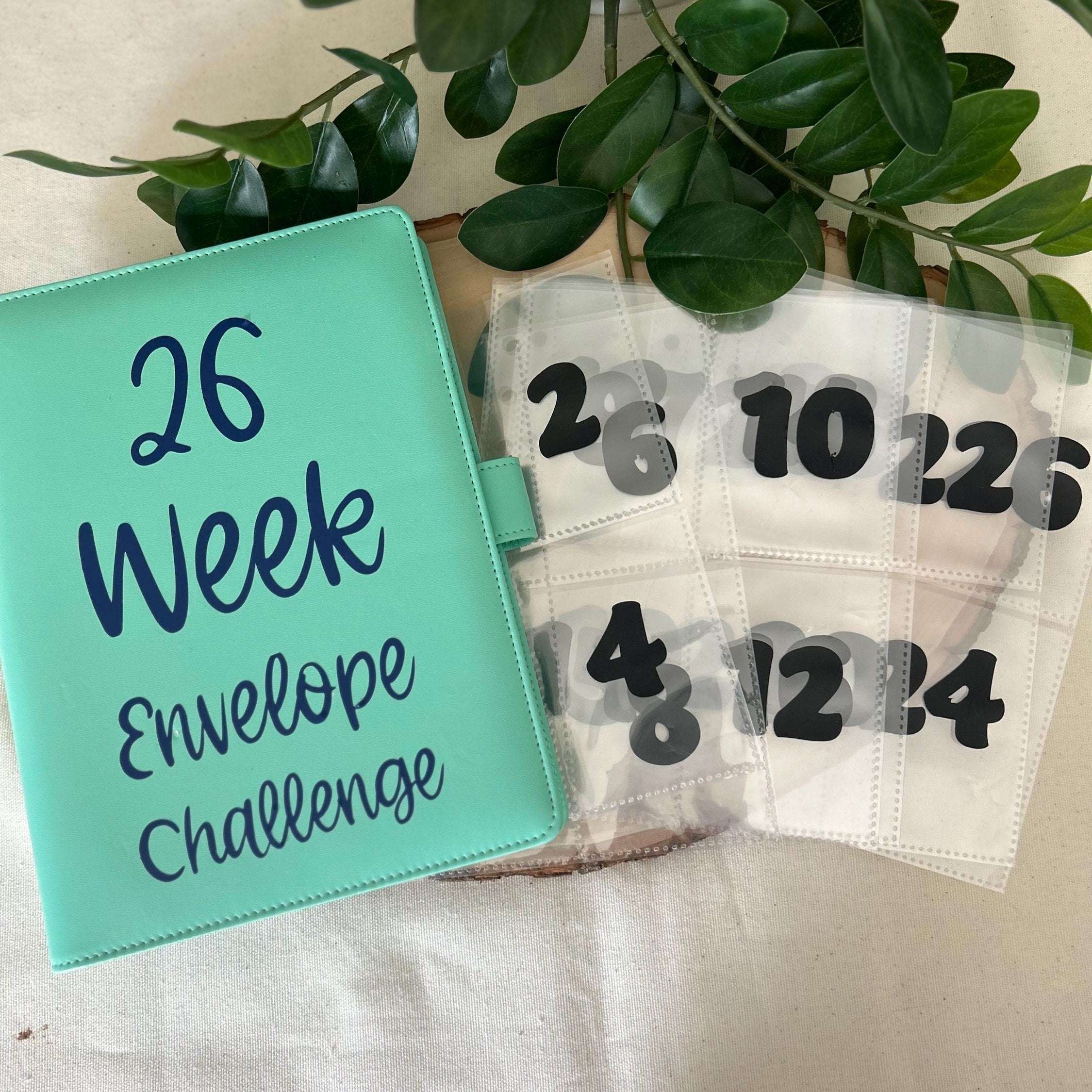 Minimalist 26 Week Savings Challenge printable with numbered envelopes and savings goals, designed for budgeting and money-saving enthusiasts to track progress and achieve financial goals efficiently.