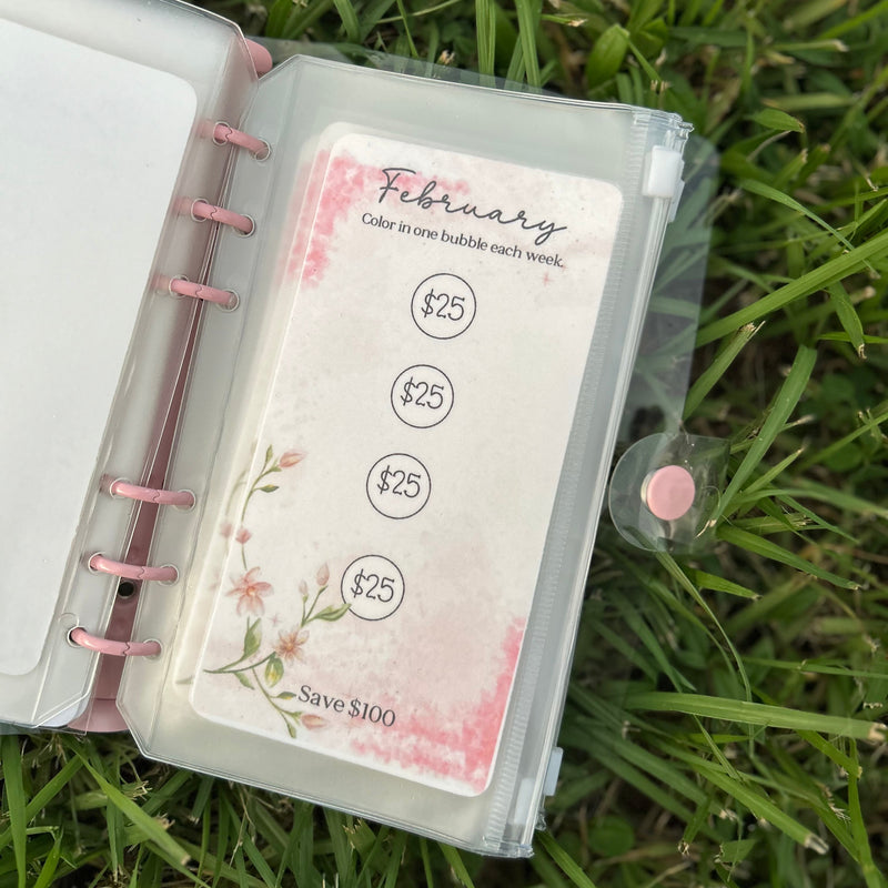 Planner with a card titled 'February' on grass