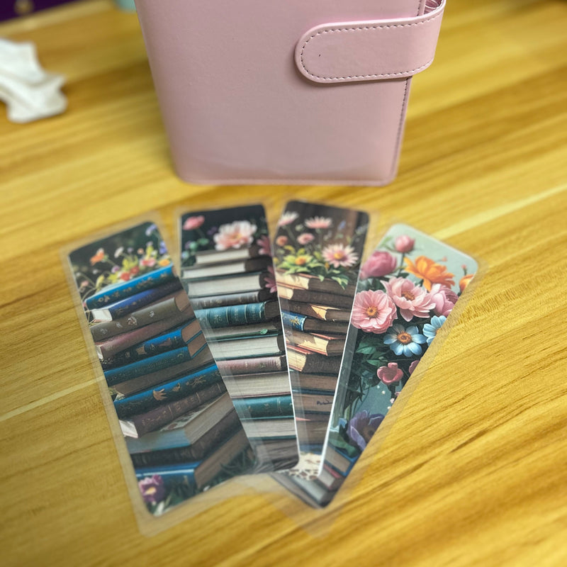 A set of floral botanical bookmarks featuring delicate flower illustrations and book-themed designs, displayed on a neutral background. Perfect for readers, journalers, and stationery lovers.
