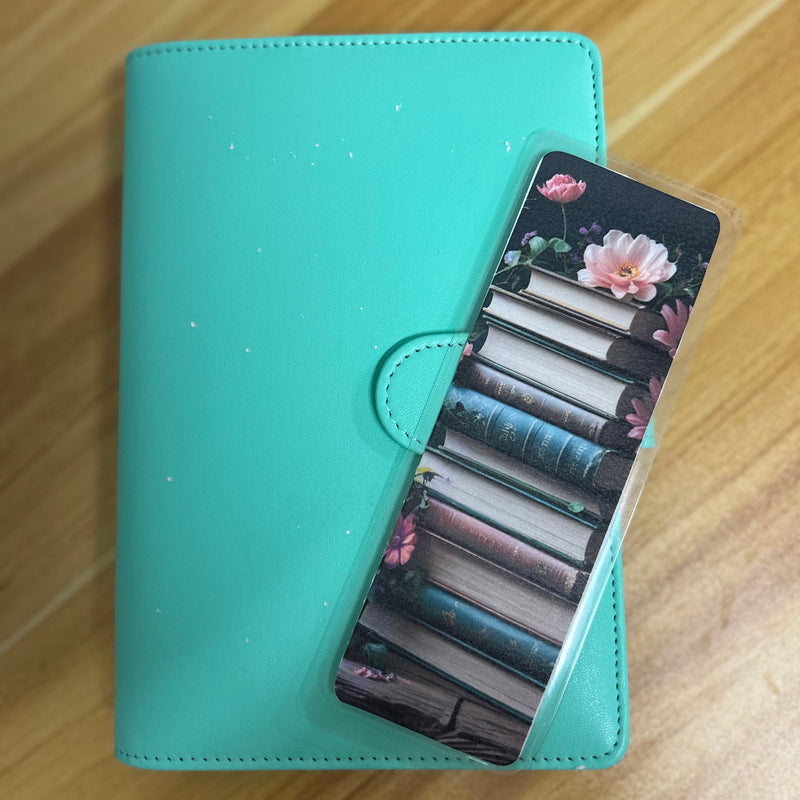 A set of floral botanical bookmarks featuring delicate flower illustrations and book-themed designs, displayed on a neutral background. Perfect for readers, journalers, and stationery lovers.