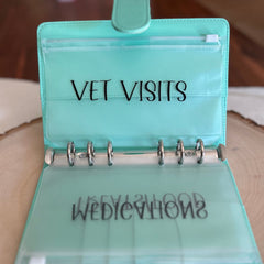 Personalized and custom pet budget tracker binder featuring a tailored cover design, organized sections, and budgeting tools, perfect for pet owners to manage expenses, track supplies, and care for their furry friends.