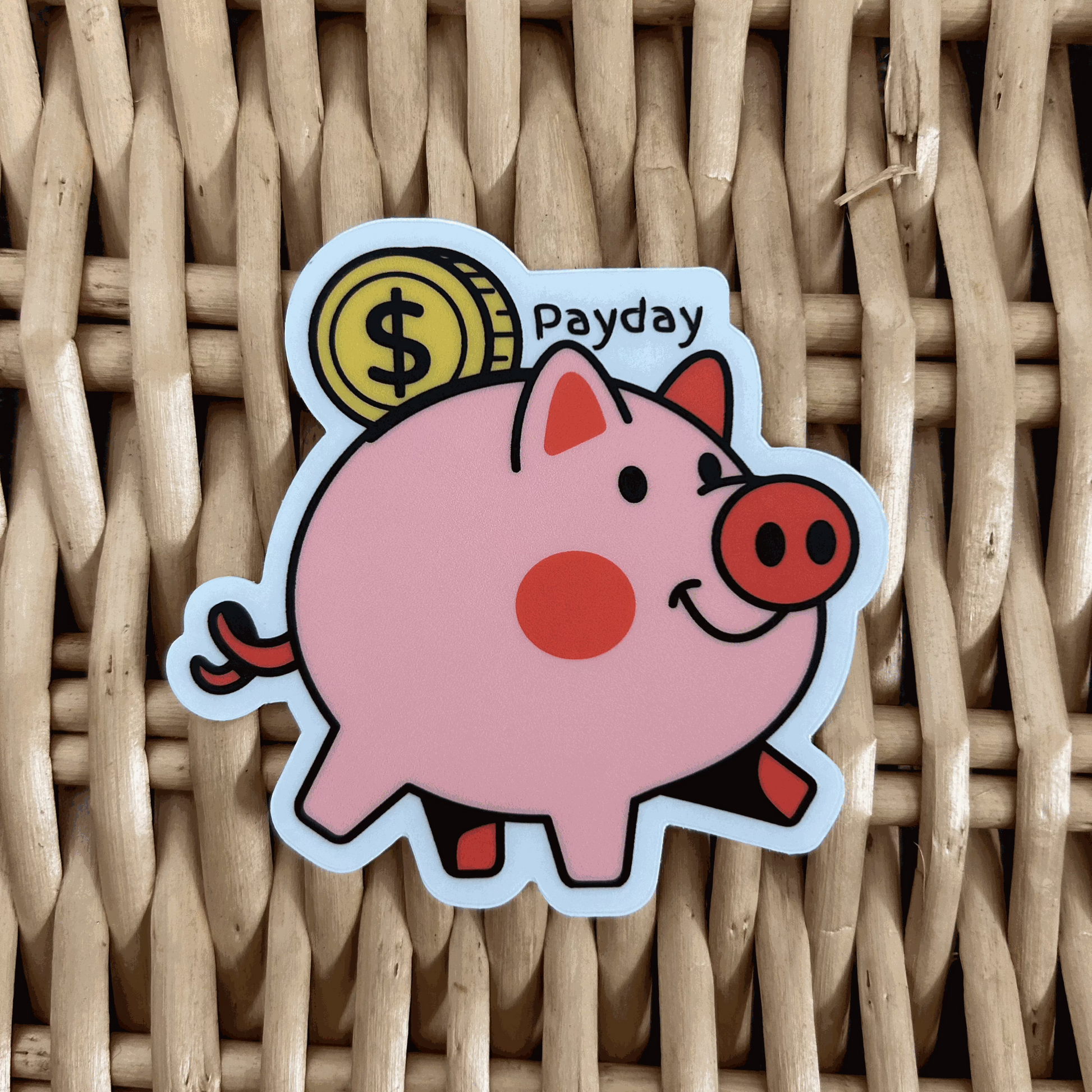 A custom sticker depicting a pink piggy bank with the words 'Payday' on a woven background.