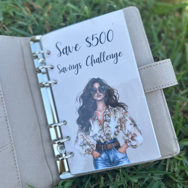 Planner with 'Save $500 Savings Challenge' on a grass background