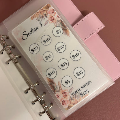 Money tracking sheet with floral design in a pink planner