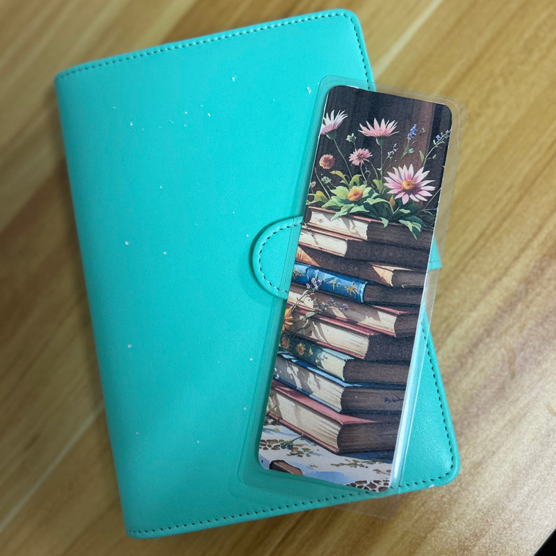 A set of floral botanical bookmarks featuring delicate flower illustrations and book-themed designs, displayed on a neutral background. Perfect for readers, journalers, and stationery lovers.