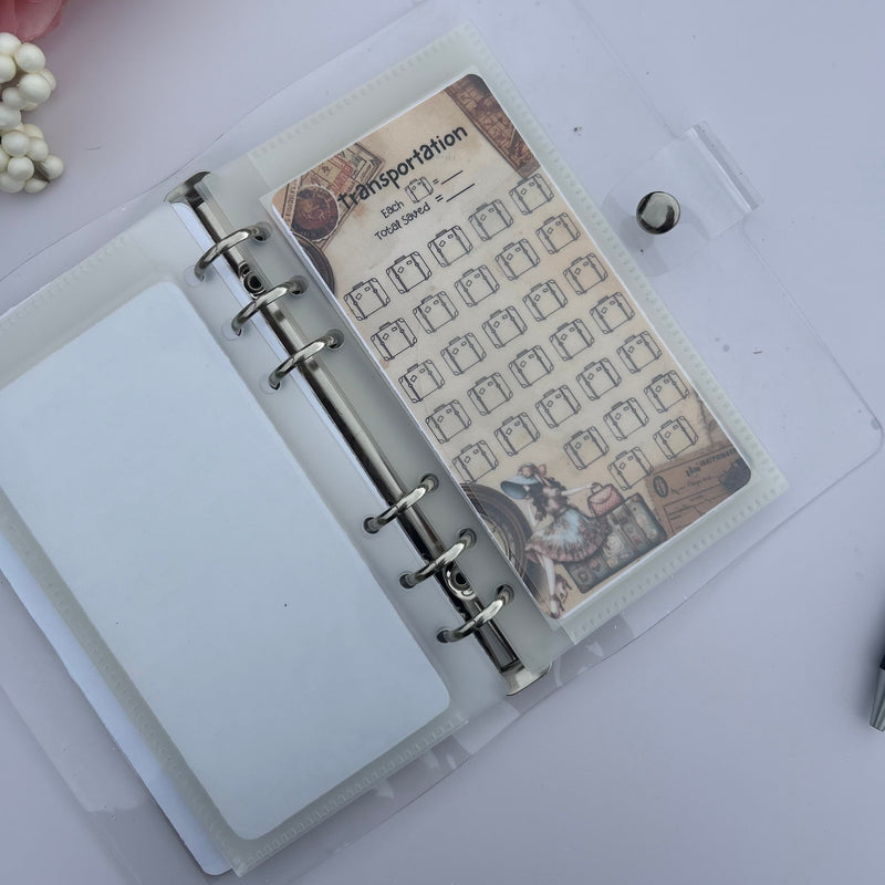 Open ring-bound notebook with a decorative page on a light pink background