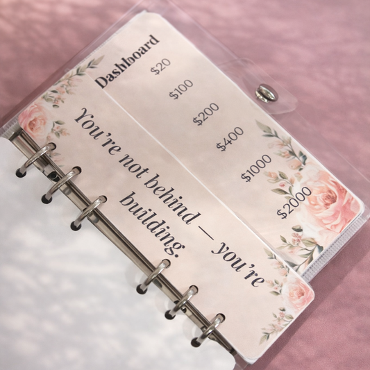 Planner with floral design on a pink background