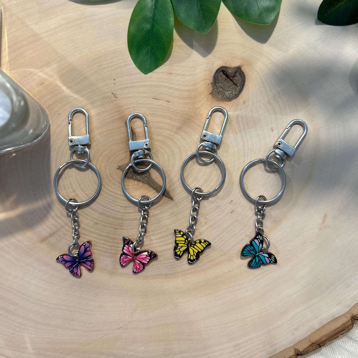 Elegant butterfly keychain and binder charm featuring a delicate butterfly design, perfect for accessorizing planners, budget binders, or keyrings with a touch of nature-inspired beauty.