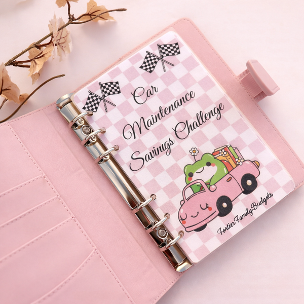 Pink planner with a car maintenance savings challenge design on a light pink background.