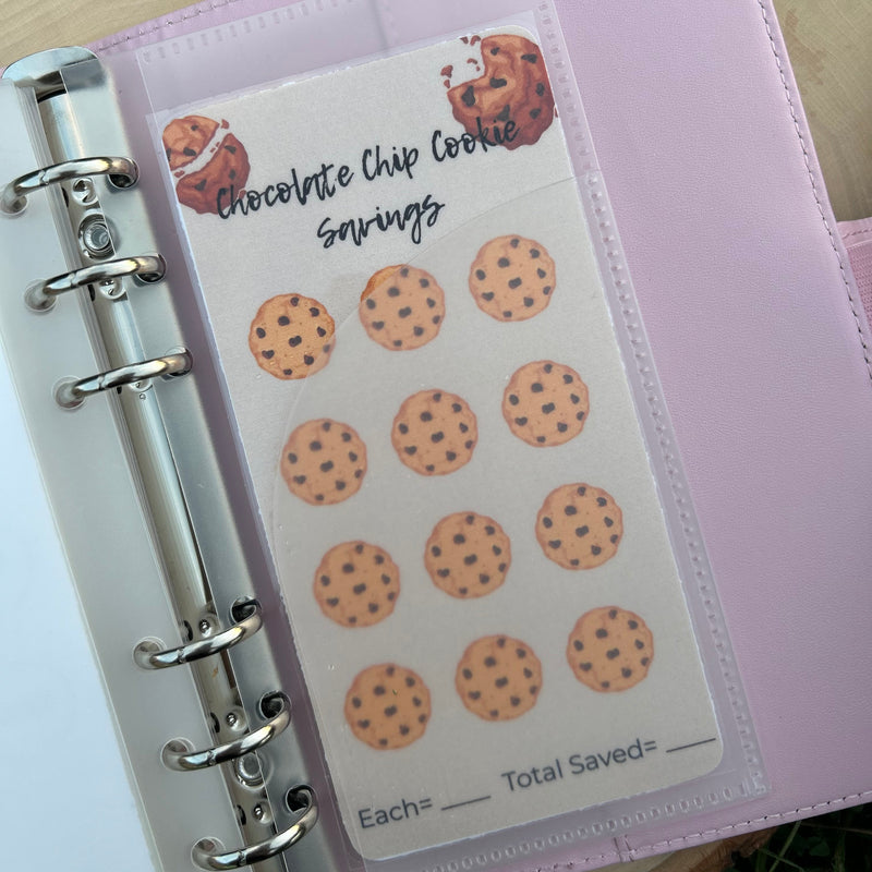 Notebook with cookie-themed stickers on a wooden surface