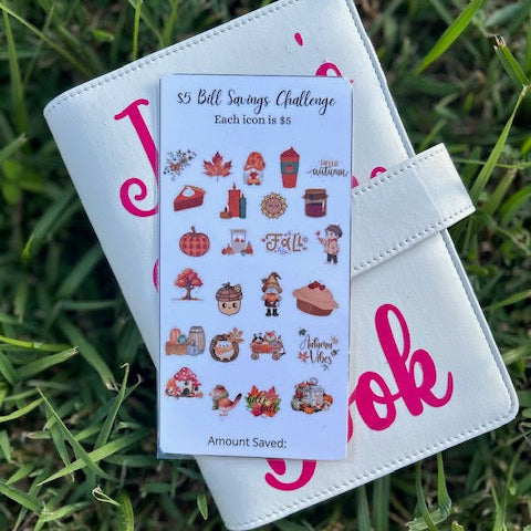Small notebook with a sticker sheet on grass