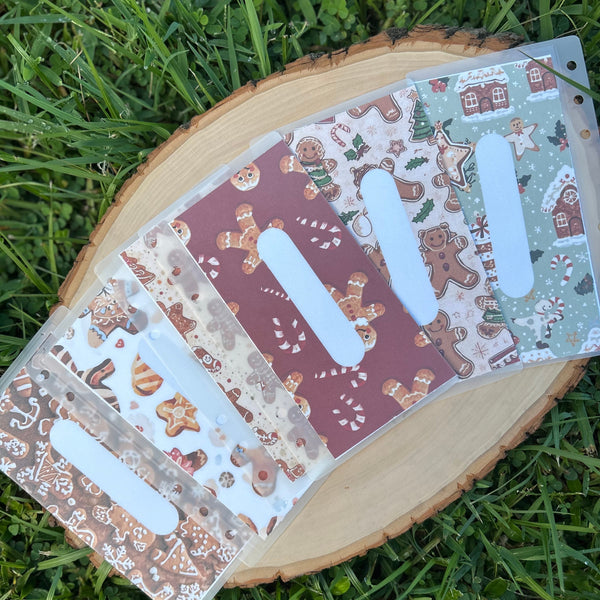 Decorative cash envelopes with gingerbread design on grass