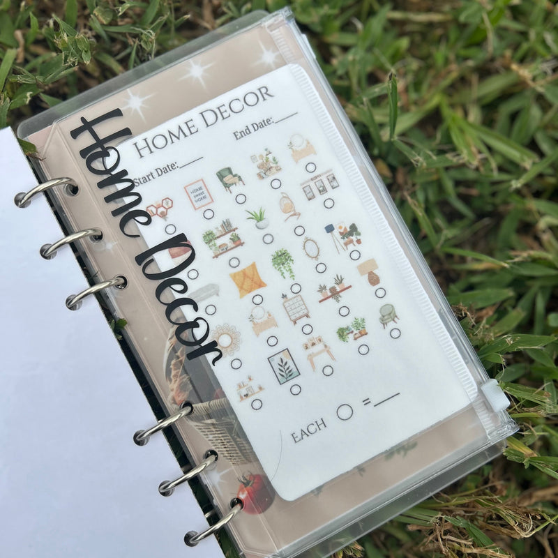 Planner with a 'Home Decor' checklist on a grass background