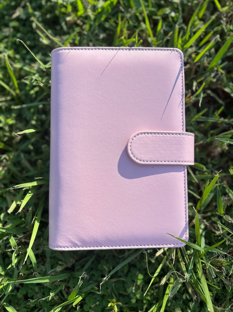 Pink planner on grass