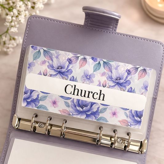 Purple planner with floral label and 'Church' text on a light background