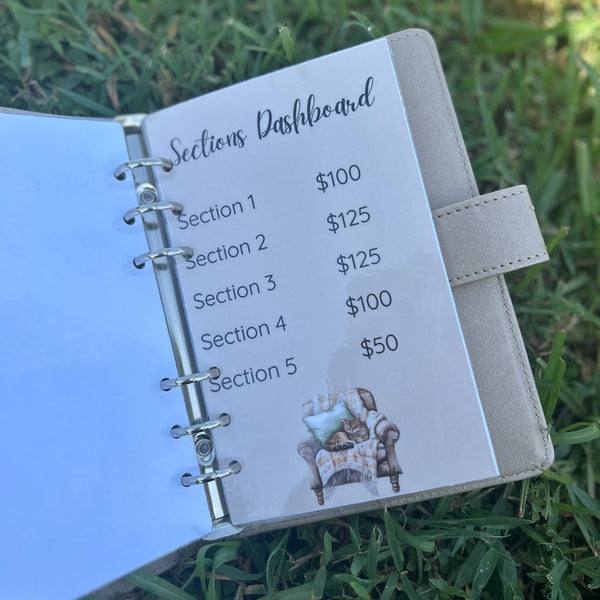 Open planner with sections dashboard on a grass background