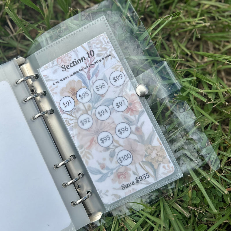 Planner with a clear cover on grass