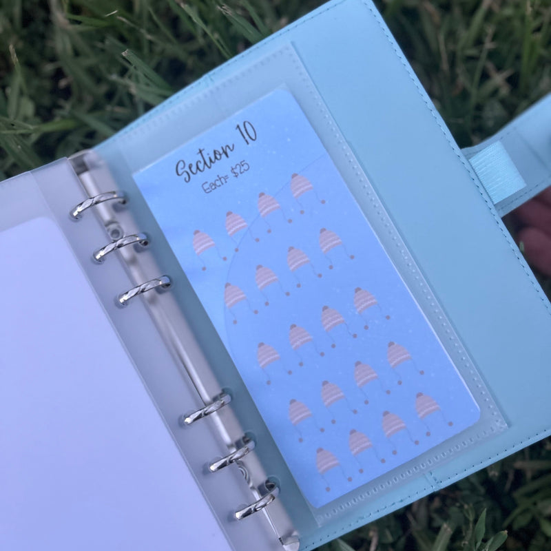 Light blue planner with a section divider labeled 'Section 10' on a grassy background