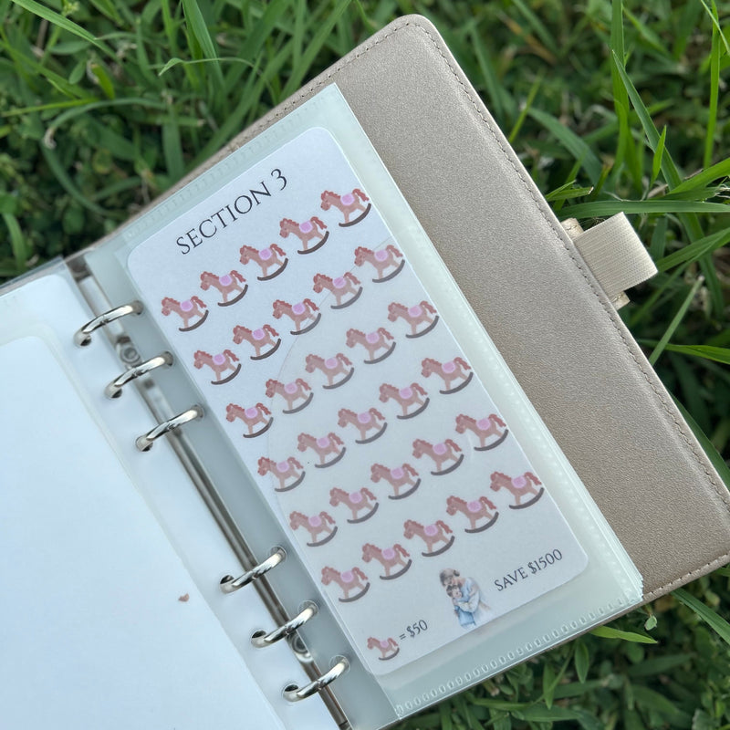 Planner with savings challenges on the grass