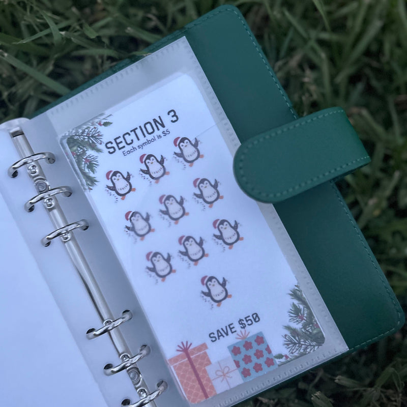 Green planner with stickers on a grassy background