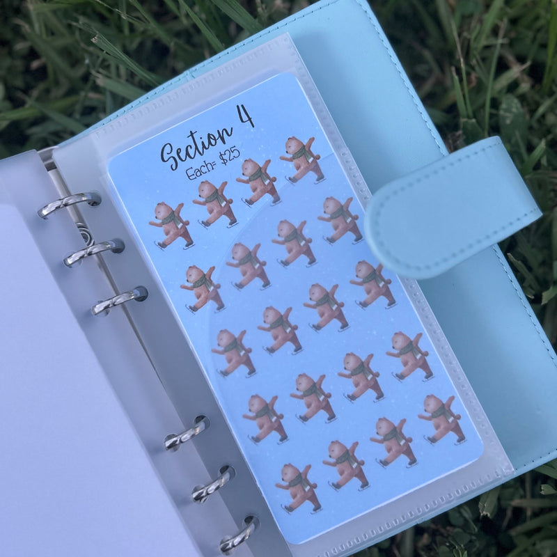 Sheet of stickers with bear illustrations in a planner on grass