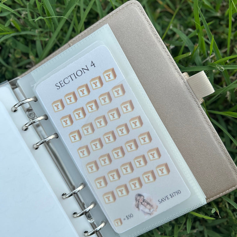 Planner with a section tab on grass