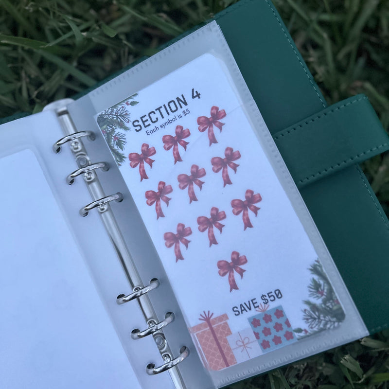 Open planner with decorative stickers on a grassy background