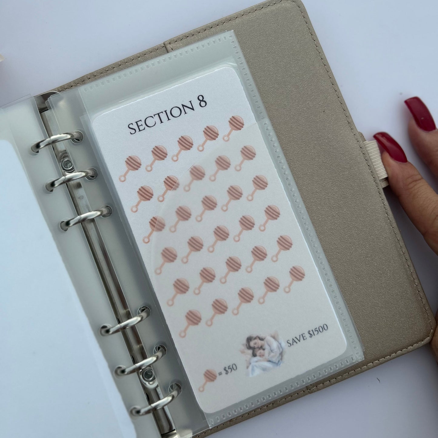 Planner with a card featuring 'Section 8' designs on a white background