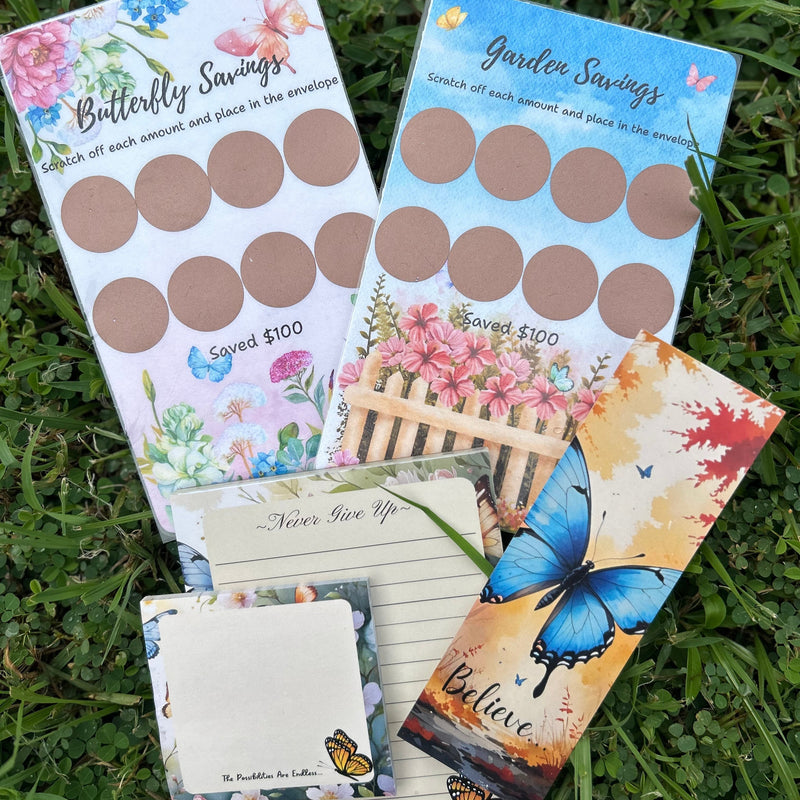 Set of savings envelopes with butterfly and garden designs on a grass background