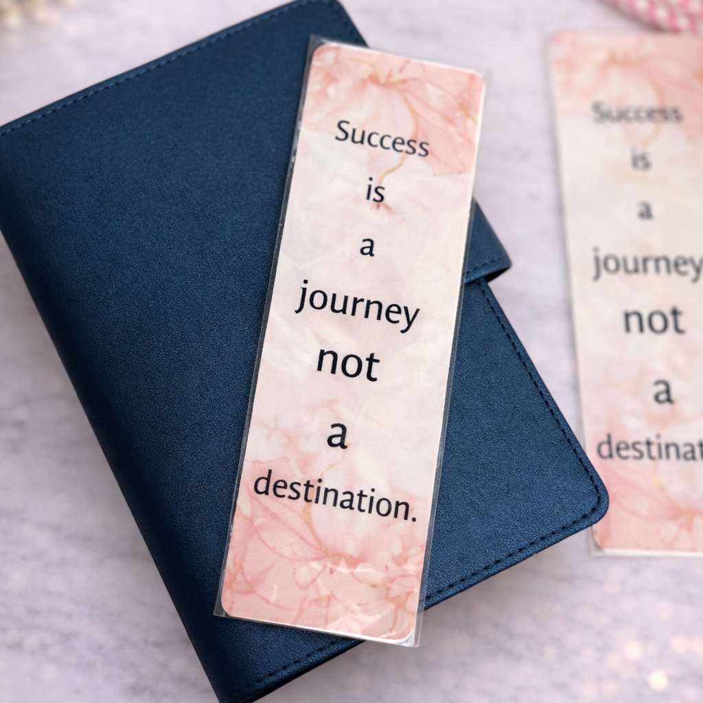 Bookmarks with motivational quote on a textured surface