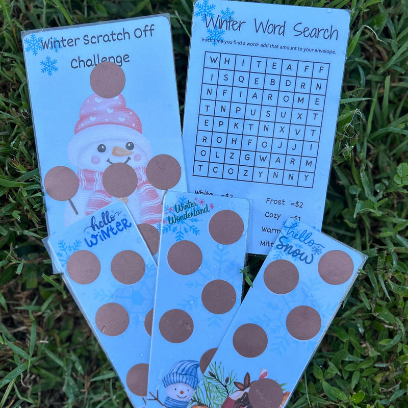 Three winter-themed activity cards on grass